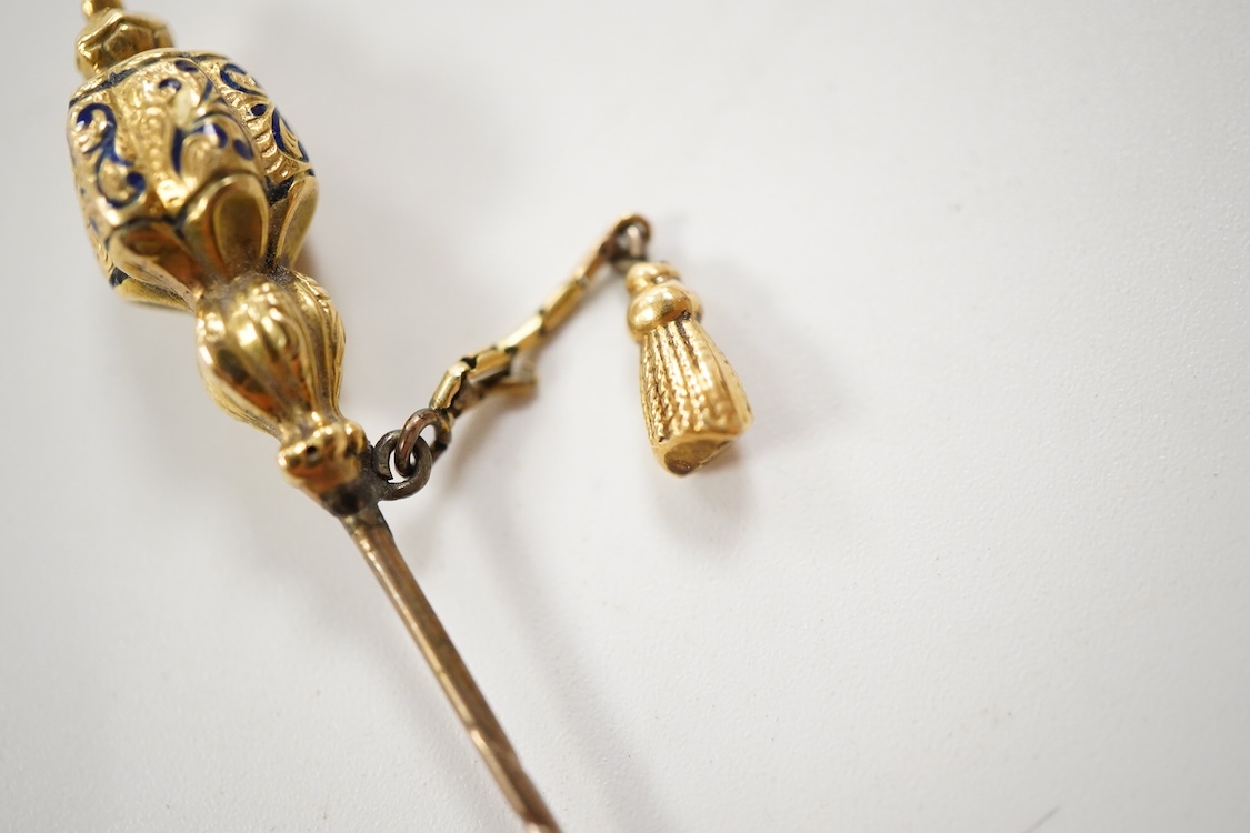 An early 20th century Viennese yellow metal, ruby, diamond and sapphire set 'clover' stick pin, 68mm, together with a yellow metal and blue enamel set stick pin.